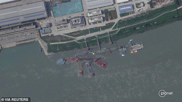 A series of satellite images from Planet Labs from June appear to show cranes at the Wuchang shipyard in Wuhan Shi, China, June 15