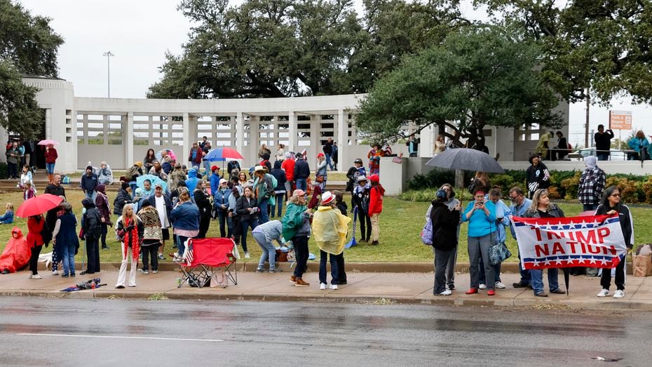 QAnon supporters gather along Elm Street at Dealey Plaza in downtown Dallas on Nov. 2, 2021. The group believes John F. Kennedy Jr., who died in plane crash in 1999, will return and reinstate Donald Trump as president. (Elias Valverde II/The Dallas Morning News)